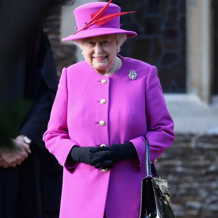 queen elizabeth purple dress Queen Elizabeth just channeled Princess Diana in a red and purple dress